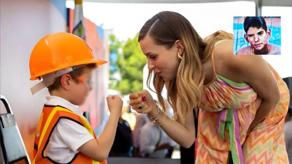 La-campana-sin-verguenza-de-mariana-rodriguez - La Razón Nl Woman Greets a Young Boy in an Orange Hard Hat and Safety Vest with a Fist Bump at a Construction-themed Event Bystanders Nearby in the Background. - La Razón Nl